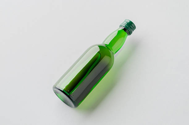 istock Miniature spirits, liquor bottle mockup, green glass. 2240963829