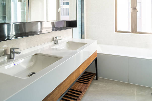 istock Modern bathroom interior with bathtub and cabinet double sinks 2240965838