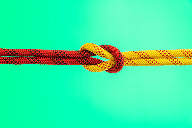 istock Ropes with reef knot on green background 2240966347