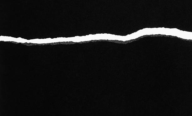 istock Tear out a crack on the black paper 2240966470