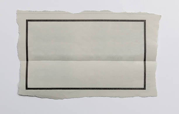 istock Piece of newspaper sheet with graphic frame on white background 2240966485