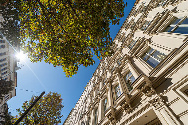 istock Old houses with trees in the sunshine 2240969050