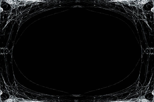 White threads of cobweb in corners ornament for Halloween greeting card on black background