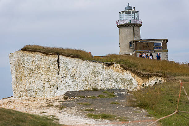 Beachy Head lighthouse from the chalk cliff edge of the south downs on the east sussex coast south east England UK