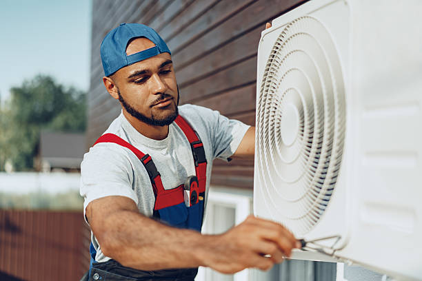 istock Young black man repairman checking an outside air conditioner unit 2240976184