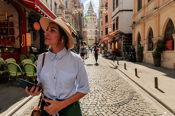 istock Smiling Woman Exploring Istanbul Streets 2240980435