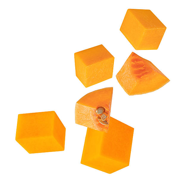 istock Flying Pumpkin cubes isolated on white background. Pumpkin Explosion. Levitating  Pumpkin pieces with seeds.  Autumn  season concept 2240980982