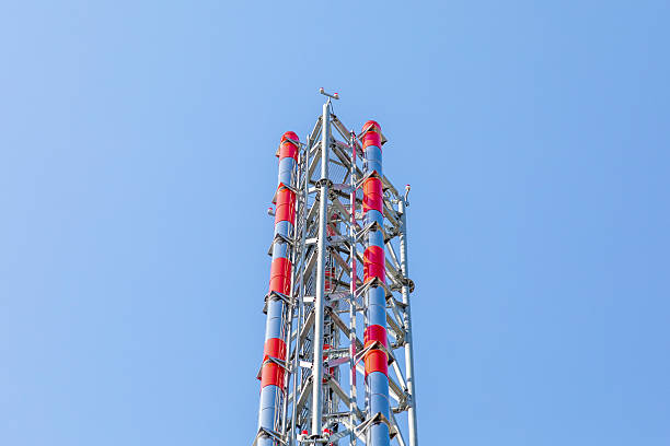istock Red and white industrial chimney against clear blue sky. Boiler room exhaust stack for heating or energy infrastructure. Real photo 2240981546