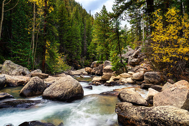 istock Rugged Canyon in Autumn with Turquoise Water Flowing 2240984264