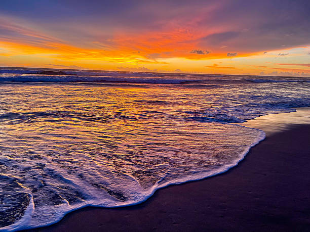 istock Gentle Ocean Wave Under Purple Evening Sky 2240987578