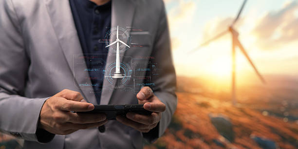 istock hologram screen Humans controlling the system Wind turbines produce electricity. Eco queue, clean energy from nature. 2240987721