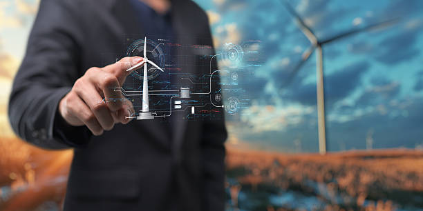 istock hologram screen Humans controlling the system Wind turbines produce electricity. Eco queue, clean energy from nature. 2240988467