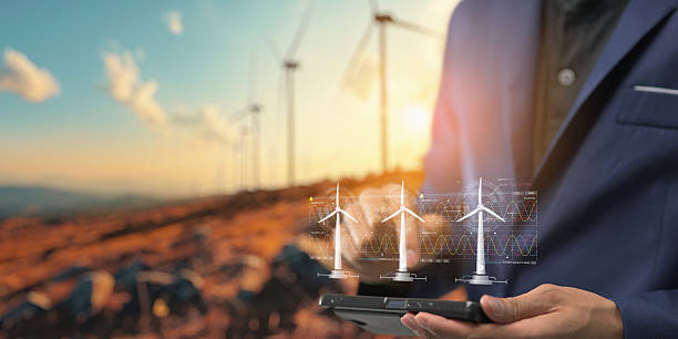 istock hologram screen Humans controlling the system Wind turbines produce electricity. Eco queue, clean energy from nature. 2240988508