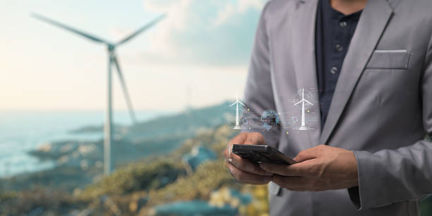 istock hologram screen Humans controlling the system Wind turbines produce electricity. Eco queue, clean energy from nature. 2240992237
