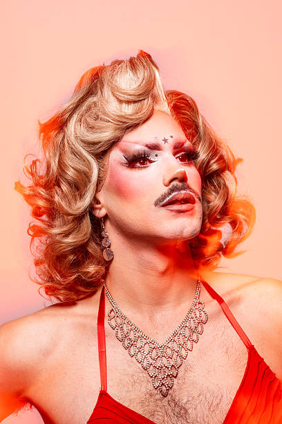 istock Vibrant Queer Expression With a Drag Performer Showcasing Bold Makeup and Elegant Attire 2240994581