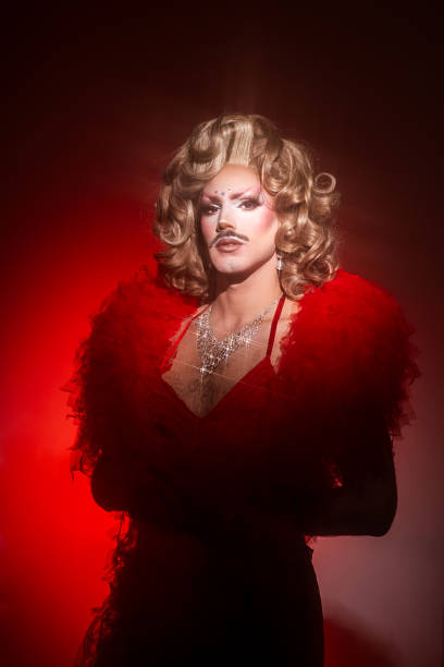 istock Glamorous Drag Queen Portrait With Bold Red Styling in a Studio Setting 2240994863