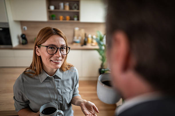 istock Couple enjoying morning coffee and conversation in kitchen 2240994883