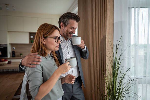 istock Professional couple enjoying morning coffee at home 2240994889