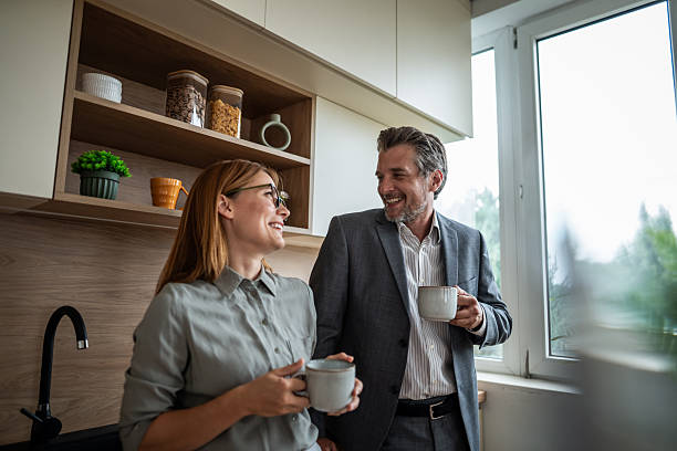 istock Business partners talking on coffee break in modern kitchen 2240995467