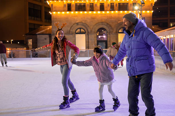 istock Family Ice Skating at Christmas 2241001053