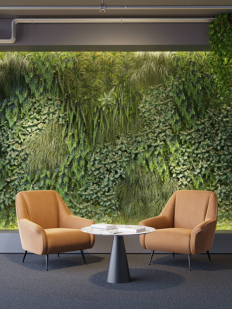 istock 3d render of a Vertical green wall in modern office area with two orange lounge chairs 2241004638