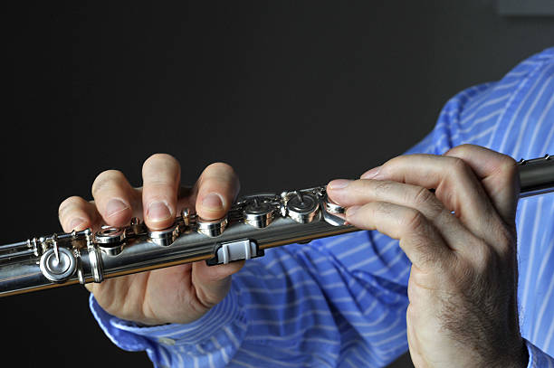 Young Woman Playing the Flute , Musician , Entertainment Culture