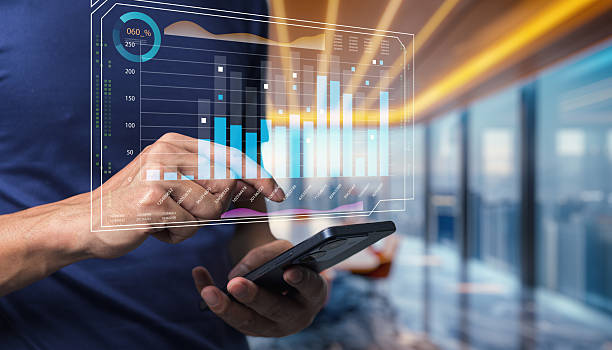 istock Person Using Smartphone for Digital Data Analysis with Graphical Display of Business Analytics and Statistics in Modern Office Environment 2241010368