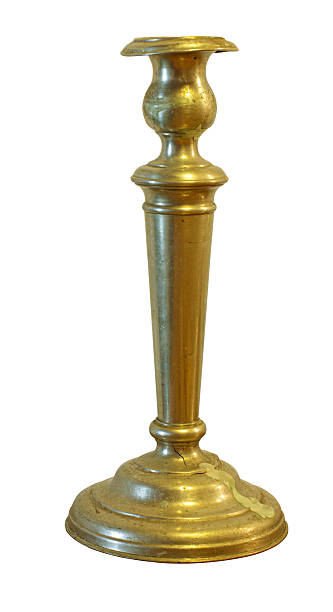 istock Vintage brass candlestick holding candle wax drips 2241011561