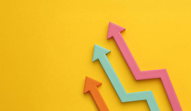 istock Multicoloured arrows pointing up and down. Symbolise growth progress, success in business finance. Rising bars of graphs represent market trends, return on investment, business development, financial graphs. 2241012527