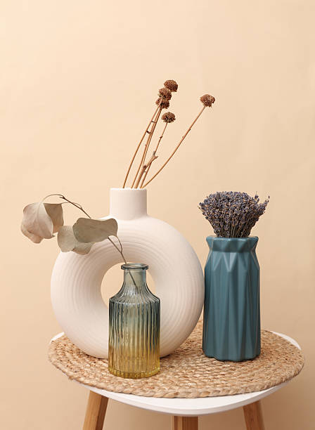 istock Minimalist modern vases with dry grass on a table 2241017919