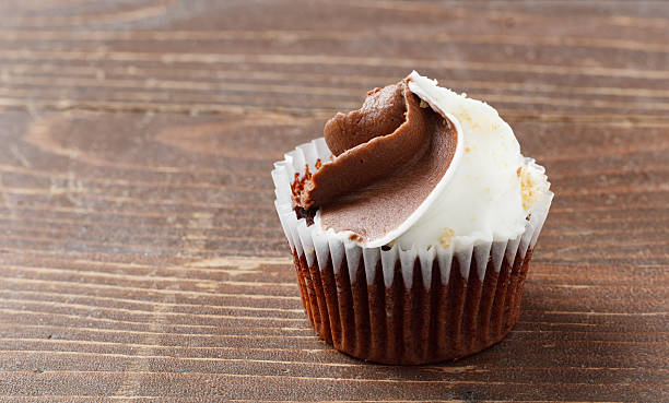 istock Mini Cupcake With Frosting on Rustic Wood 2241024208