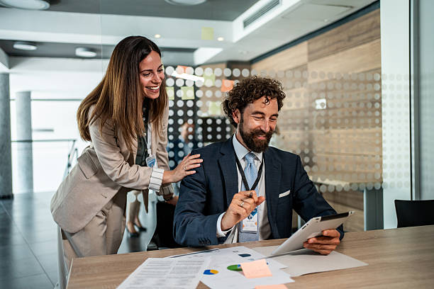 istock Business colleagues collaborating on digital tablet in modern office 2241024601