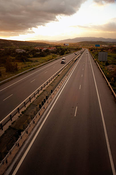 istock Road and the cloudy sunset sky 2241024739