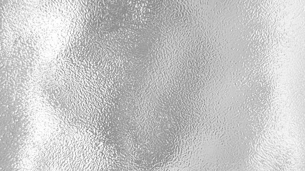 istock Grainy silver leaf bright aluminum foil texture tinfoil surface abstract gradient metallic monochrome seamless background 2241026189