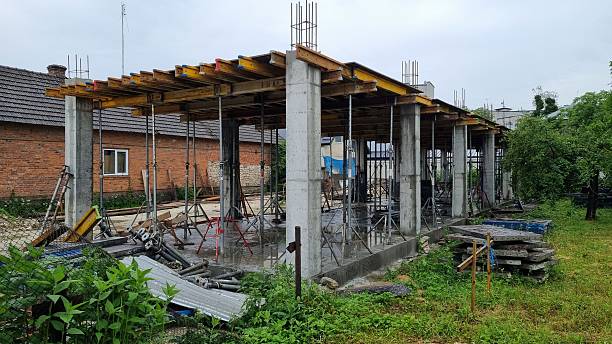 istock Reinforced concrete structure under construction with steel columns and scaffolding 2241027662