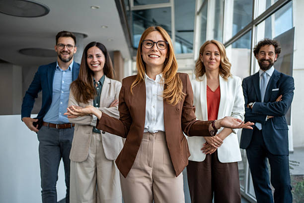 istock Business team leader gesturing welcoming new employees 2241029571