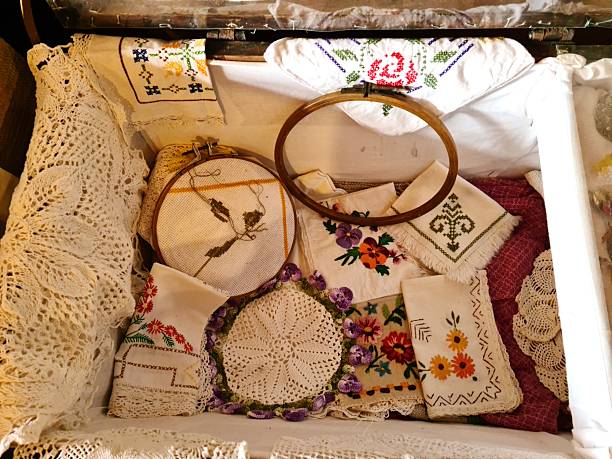 Old cloth tablecloths and napkins trimmed with colorful flowers and handmade patterns.