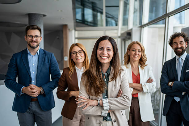 istock Business team standing together in a modern office 2241029681