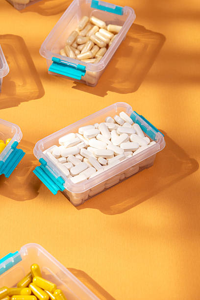 istock Different nutritional supplements, vitamins and minerals in small containers 2241033109