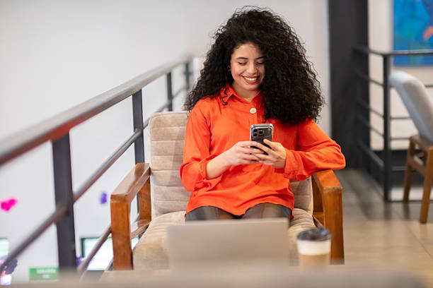 istock young professional cheerfully performing their executive duties from their electronic device in a modern work environment 2241035109