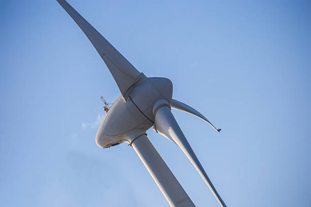 istock White wind turbines stand on the coast 2241036020