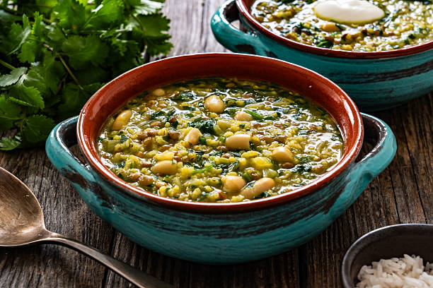 istock Aash-e Jow - persian barley soup on wooden table 2241041245