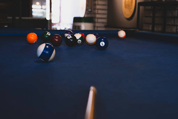 istock Colorful billiard balls on an american pool table. 2241043751