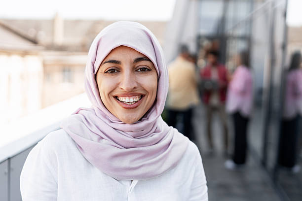istock Smiling Arab woman wearing hijab looking at camera 2241047693