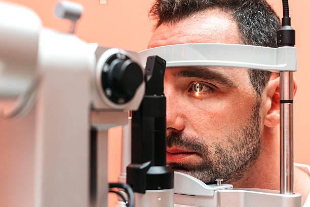 istock Male patient undergoing vision examination using slit lamp 2241061851