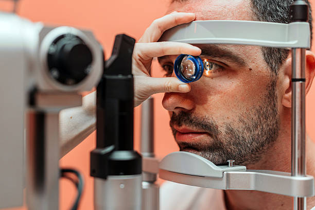 istock Male patient undergoing vision examination using slit lamp 2241061861