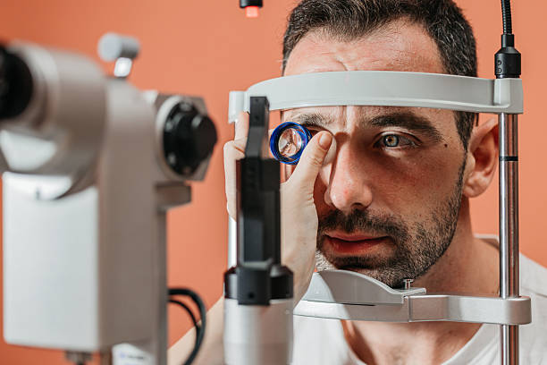 istock Male patient undergoing vision examination with slit lamp 2241061887