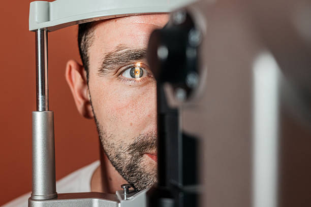 istock Male patient undergoing vision examination with slit lamp 2241061953