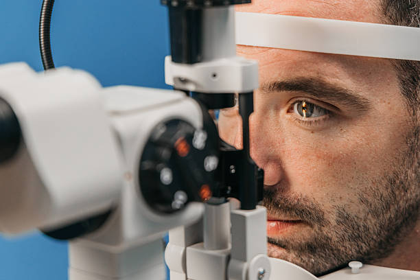 istock Male patient undergoing vision examination with slit lamp 2241061969