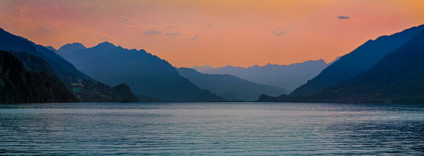 istock Serene Lake Brienz at Sunset with Mountain Backdrop 2241063456